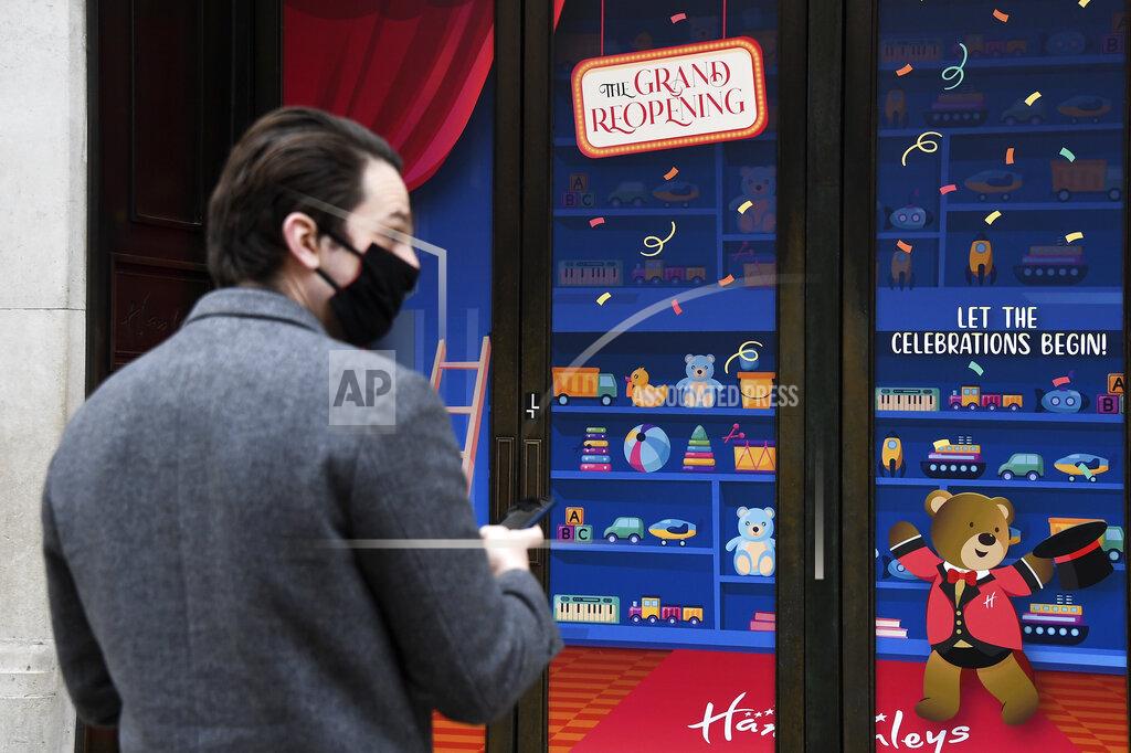 Alberto Pezzali A man stops by a shop window in Regent street in London, Monday, April 12, 2021. Millions of people in England will get their first chance in months for haircuts, casual shopping and restaurant meals on Monday, as the government takes the next step on its lockdown-lifting road map. (AP Photo/Alberto Pezzali)