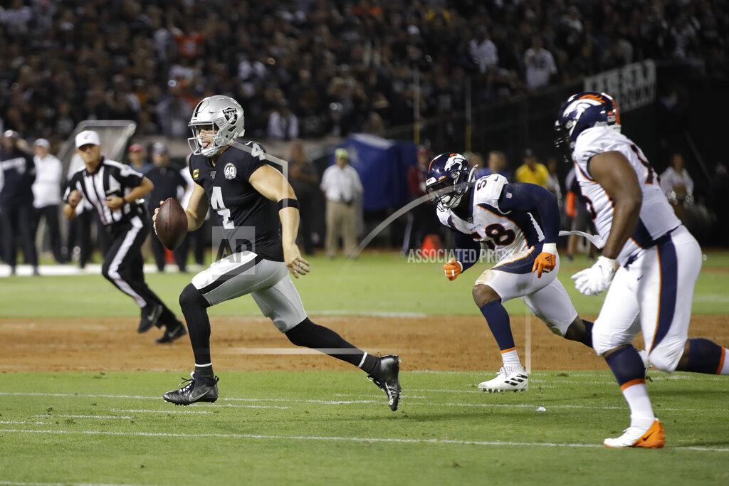 Ben Margot FILE - In this Sept. 9, 2019, file photo, Oakland Raiders quarterback Derek Carr runs with the ball during the first half of the team's NFL football game against the Denver Broncos in Oakland, Calif. The Raiders are playing at home this week for the first time in nearly seven weeks, against the Detroit Lions. (AP Photo/Ben Margot, File)