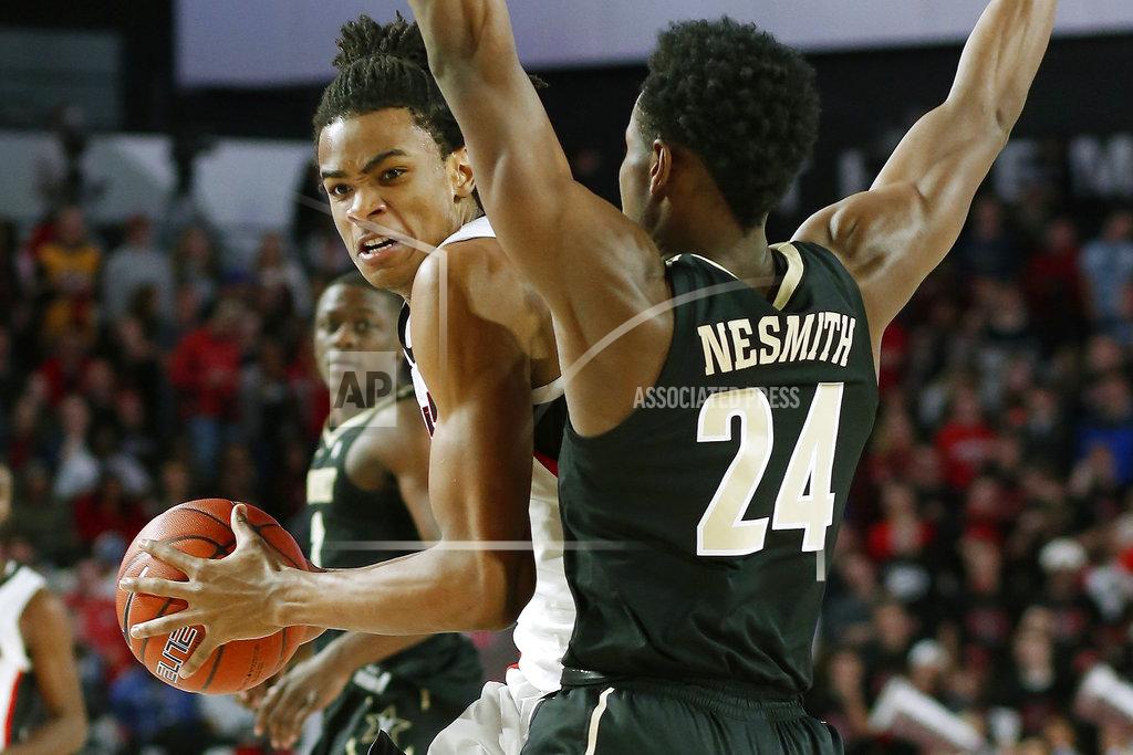 Joshua L. Jones Georgia forward Nicolas Claxton (33) moves the ball while being defended by Vanderbilt forward Aaron Nesmith (24) during an NCAA college basketball game, Wednesday, Jan. 9, 2019 in Athens, Ga. (Joshua L. Jones/Athens Banner-Herald via AP)