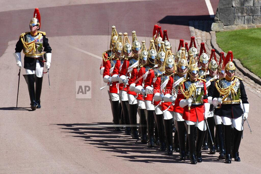 Jeremy Selwyn Members of the military during the procession ahead of Britain Prince Philip's funeral at Windsor Castle, Windsor, England, Saturday April 17, 2021. Prince Philip died April 9 at the age of 99 after 73 years of marriage to Britain's Queen Elizabeth II. (Jeremy Selwyn/Pool via AP)