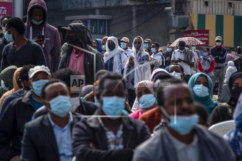 Ben Curtis Ethiopians queue on the street as they wait to cast their votes in the general election at a polling center in the capital Addis Ababa, Ethiopia Monday, June 21, 2021. Ethiopia was voting Monday in the greatest electoral test yet for Prime Minister Abiy Ahmed as insecurity and logistical issues meant ballots wouldn't be cast in more than 100 constituencies of the 547 across the country. (AP Photo/Ben Curtis)
