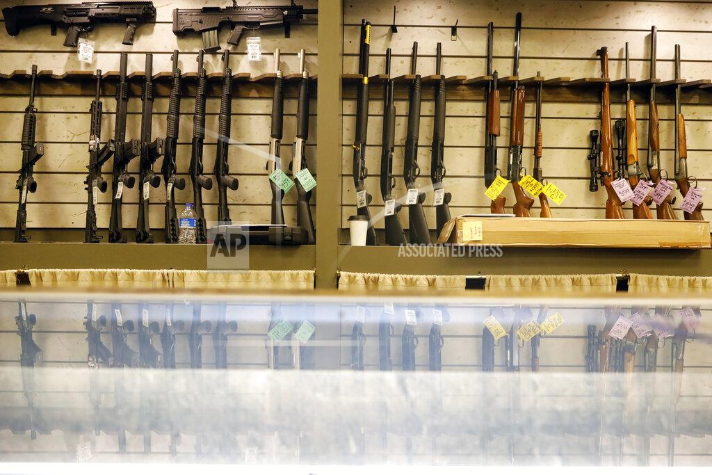 Shafkat Anowar Guns are displayed in the showroom of Maxon Shooter's Supplies and Indoor Range, Friday, April 30, 2021, in Des Plaines, Ill. After a year of pandemic lockdowns, mass shootings are back, but the guns never went away. As the U.S. inches toward a post-pandemic future, guns are arguably more present in the American psyche and more deeply embedded in American discourse than ever before. The past year's anxiety and loss fueled a rise in gun ownership across political and socio-economic lines. (AP Photo/Shafkat Anowar)