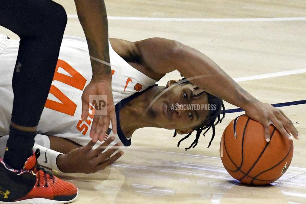 Holly Hart Illinois guard Adam Miller (44) battles for a rebound against Maryland in the first half of an NCAA college basketball game Sunday, Jan. 10, 2021, in Champaign, Ill. (AP Photo/Holly Hart)