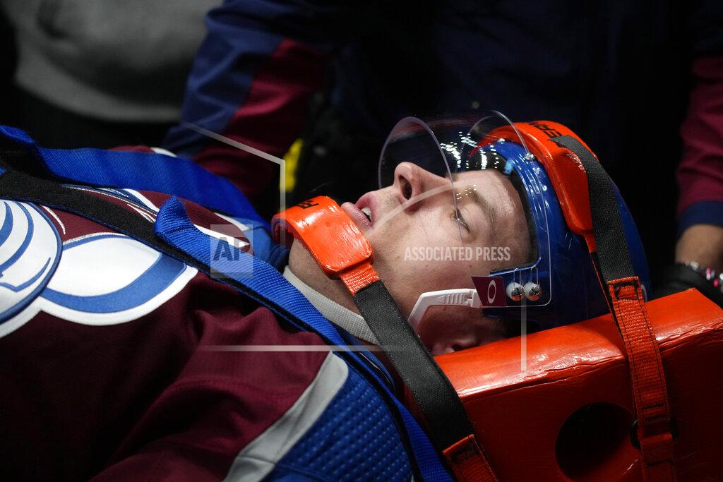 David Zalubowski Colorado Avalanche defenseman Jacob MacDonald is taken away on a gurney after being injured against the Florida Panthers in the second period of an NHL hockey game Sunday, Dec. 12, 2021, in Denver. (AP Photo/David Zalubowski)