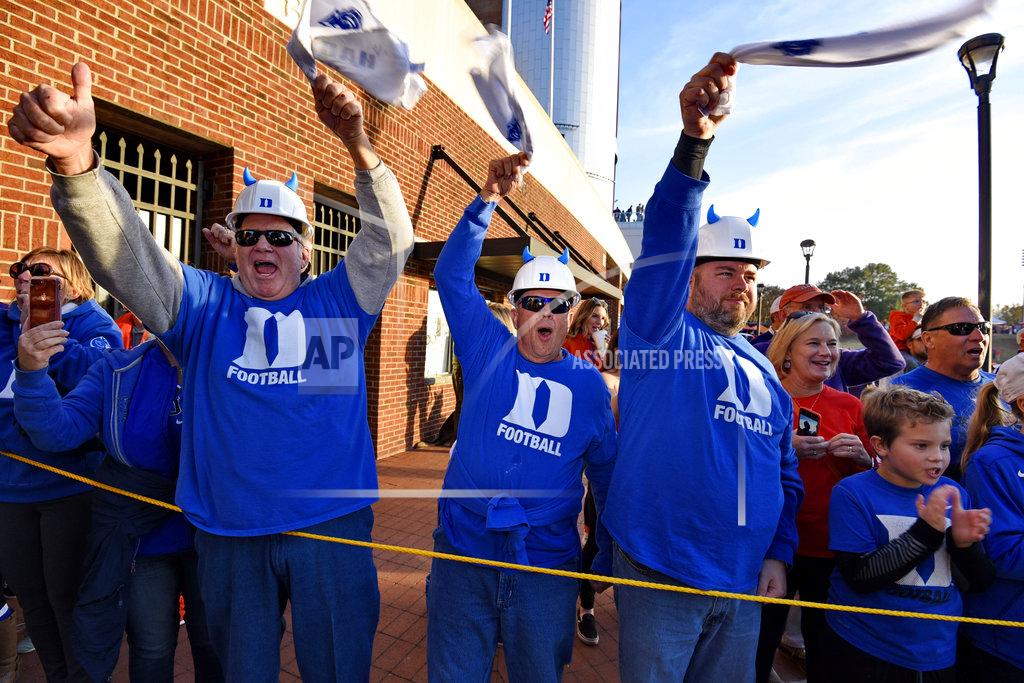 Richard Shiro Duke fans greet the arrival of the Blue Devils before an NCAA college football game against Clemson, Saturday, Nov. 17, 2018, in Clemson, S.C. (AP Photo/Richard Shiro)