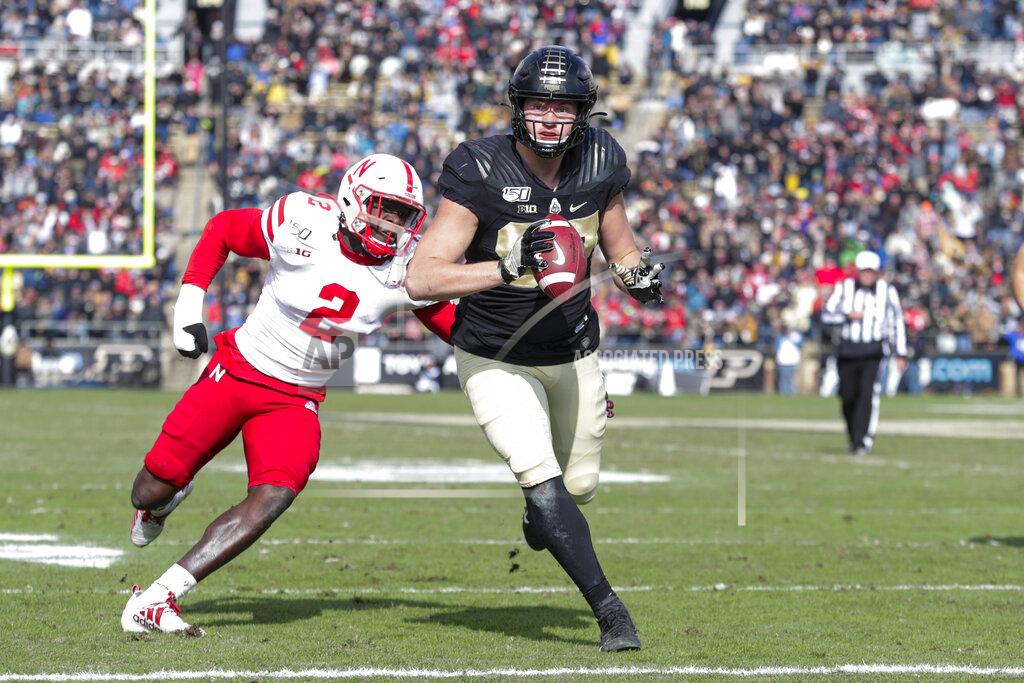 Michael Conroy Purdue tight end Payne Durham (87) runs in for a touchdown in front of Nebraska linebacker Caleb Tannor (2) during the first half of an NCAA college football game in West Lafayette, Ind., Saturday, Nov. 2, 2019. (AP Photo/Michael Conroy)