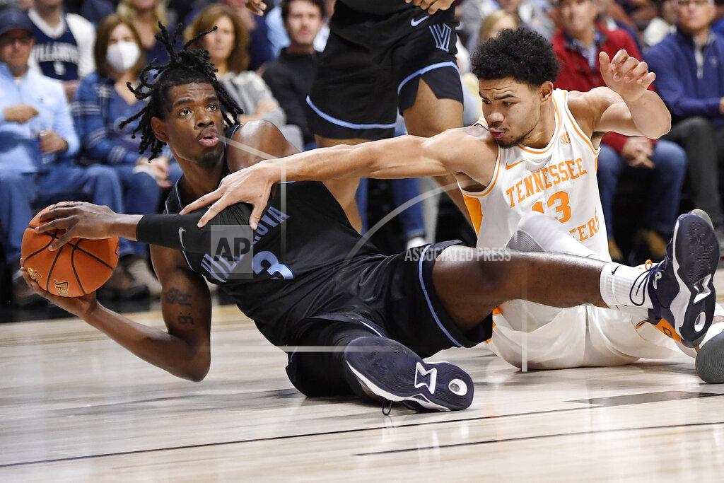 Jessica Hill Villanova's Brandon Slater (3) looks to pass under pressure from Tennessee's Olivier Nkamhoua (13) in the first half of an NCAA college basketball game, Saturday, Nov. 20, 2021, in Uncasville, Conn. (AP Photo/Jessica Hill)