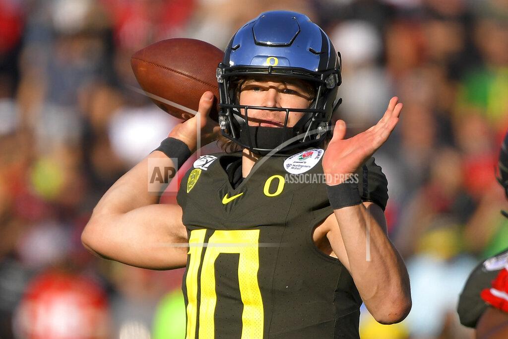 Mark J. Terrill Oregon quarterback Justin Herbert passes against Wisconsin during first half of the Rose Bowl NCAA college football game Wednesday, Jan. 1, 2020, in Pasadena, Calif. (AP Photo/Mark J. Terrill)