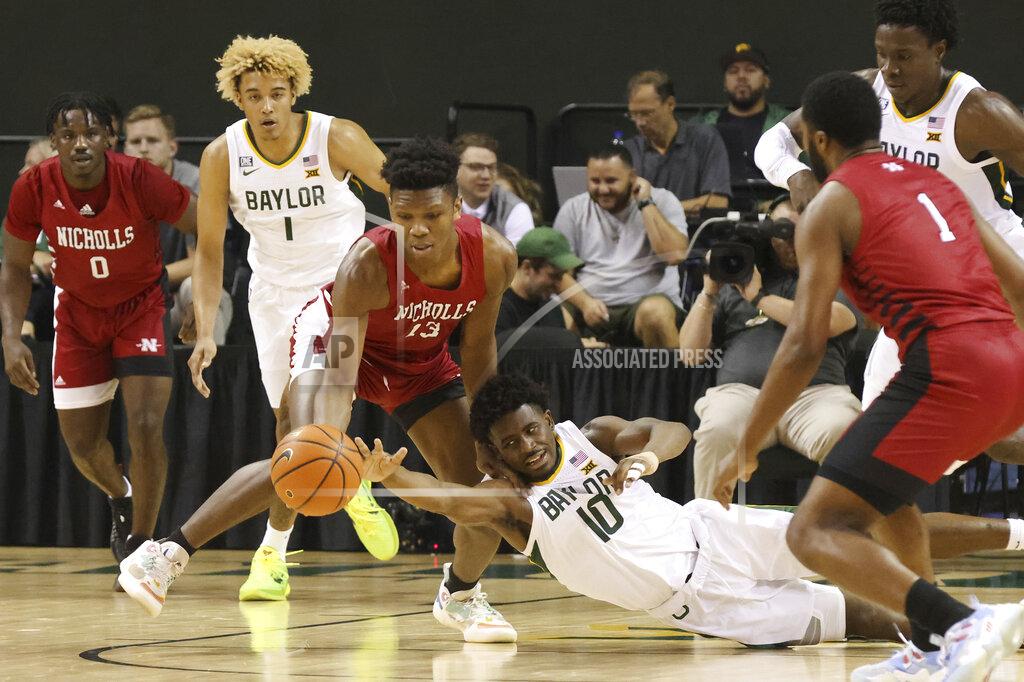 Rod Aydelotte Baylor guard Adam Flagler (10) reaches for a loose ball with Nicholls State forward Mekhi Collins (13) in the first half of an NCAA college basketball game, Monday, Nov. 15, 2021, in Waco, Texas. Others from left are Nicholls State guard Ty Gordon (0), Baylor Forward Jeremy Sochan (1) and Nicholls State forward Emmanuel Little (1) (AP Photo/Rod Aydelotte)