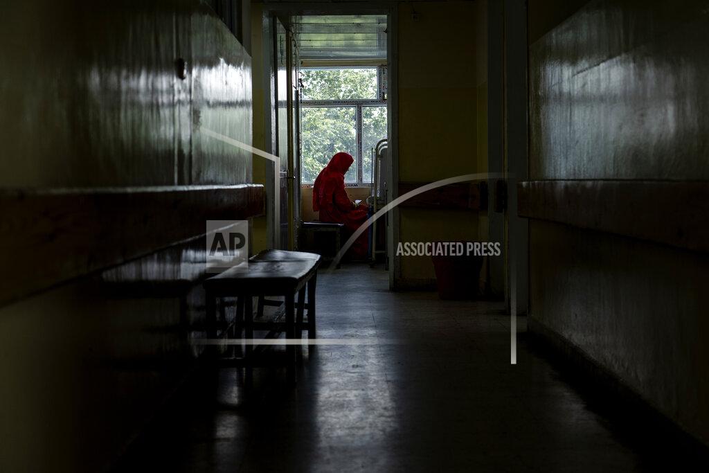 Ebrahim Noroozi An Afghan mother sits by her child's bed at the malnutrition ward of the Indira Gandhi hospital in Kabul, Afghanistan, Sunday, May 22, 2022. Some 1.1 million Afghan children under the age of five will face malnutrition by the end of the year. , as hospitals wards are already packed with sick children . (AP Photo/Ebrahim Noroozi)