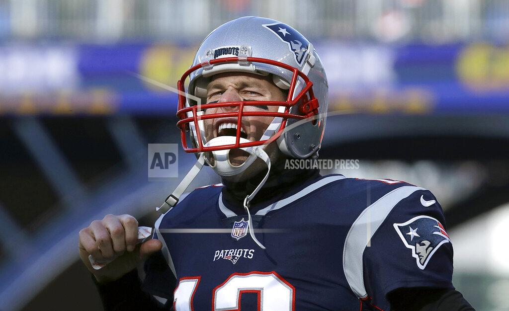 Charles Krupa New England Patriots quarterback Tom Brady charges onto the field before an NFL divisional playoff football game against the Los Angeles Chargers, Sunday, Jan. 13, 2019, in Foxborough, Mass. (AP Photo/Charles Krupa)