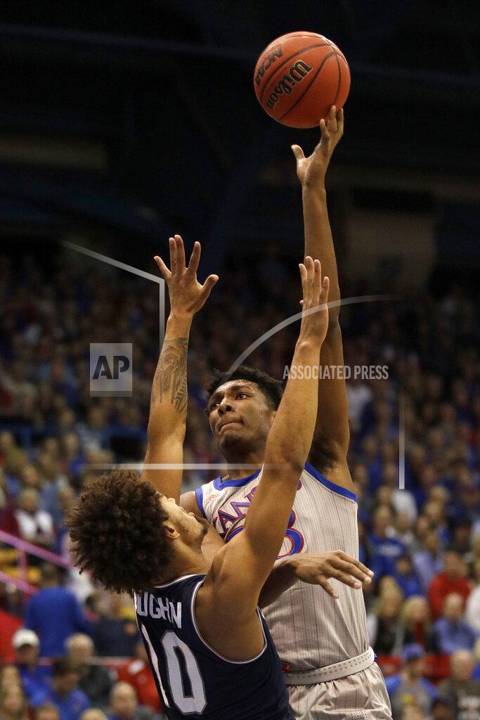 Orlin Wagner Kansas forward David McCormack, right, shoots over Monmouth forward Jarvis Vaughan (10) during the first half of an NCAA college basketball game in Lawrence, Kan., Friday, Nov. 15, 2019. (AP Photo/Orlin Wagner)