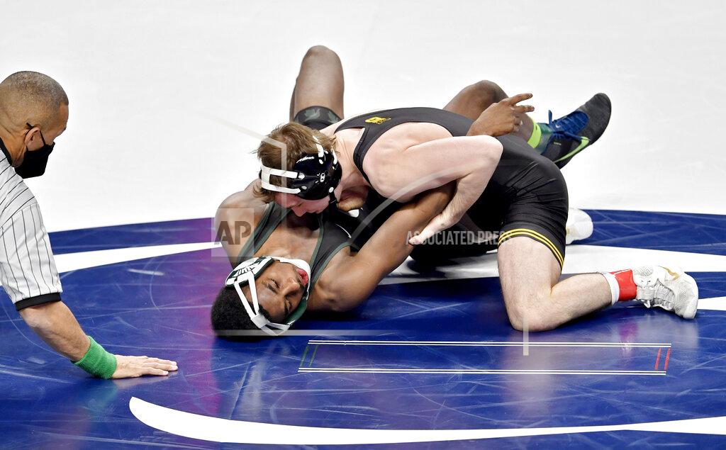 Iowa's Spencer Lee controls Michigan State's Rayvon Foley in a 125 lb semi-final bout of the 2021 Big Ten Wrestling Tournament at the Bryce Jordan Center in State College, Pa, on Saturday, March 6, 2021. (Abby Drey/Centre Daily Times via AP)