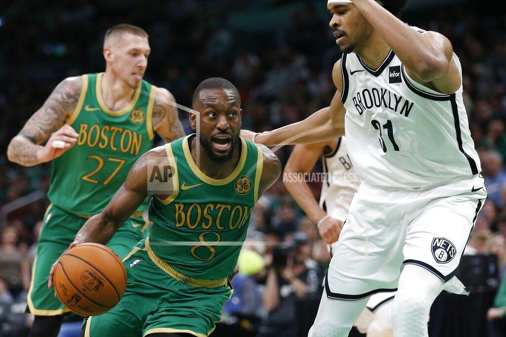 Boston Celtics' Kemba Walker (8) drives past Brooklyn Nets' Jarrett Allen (31) during the second half of an NBA basketball game in Boston, Wednesday, Nov. 27, 2019. (AP Photo/Michael Dwyer)