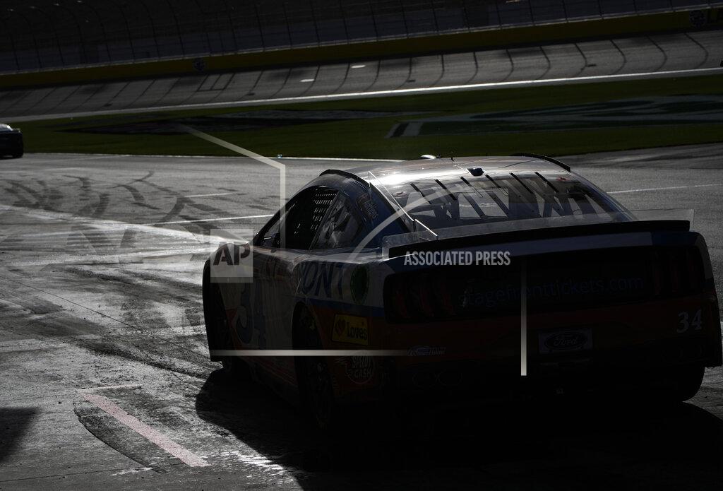 John Locher NASCAR Cup Series driver Michael McDowell (34) makes a pit stop during a NASCAR Cup Series auto race Sunday, March 6, 2022, in Las Vegas. (AP Photo/John Locher)