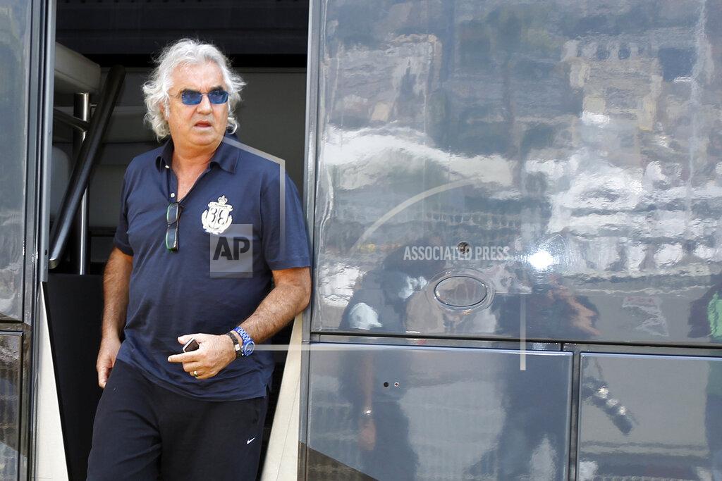Luca Bruno FILE - In this May 14, 2010 file photo, former Renault Team principal Flavio Briatore leaves the FIA motorhome ahead of the Monaco Formula One Grand Prix at the Monaco racetrack, in Monaco. On Tuesday Aug. 25, 2020, Briatore has reportedly been admitted to hospital in Milan with coronavirus, there has been no official statement from the hospital but multiple reports say Briatore’s condition is serious but he is not in intensive care. (AP Photo/Luca Bruno, file)