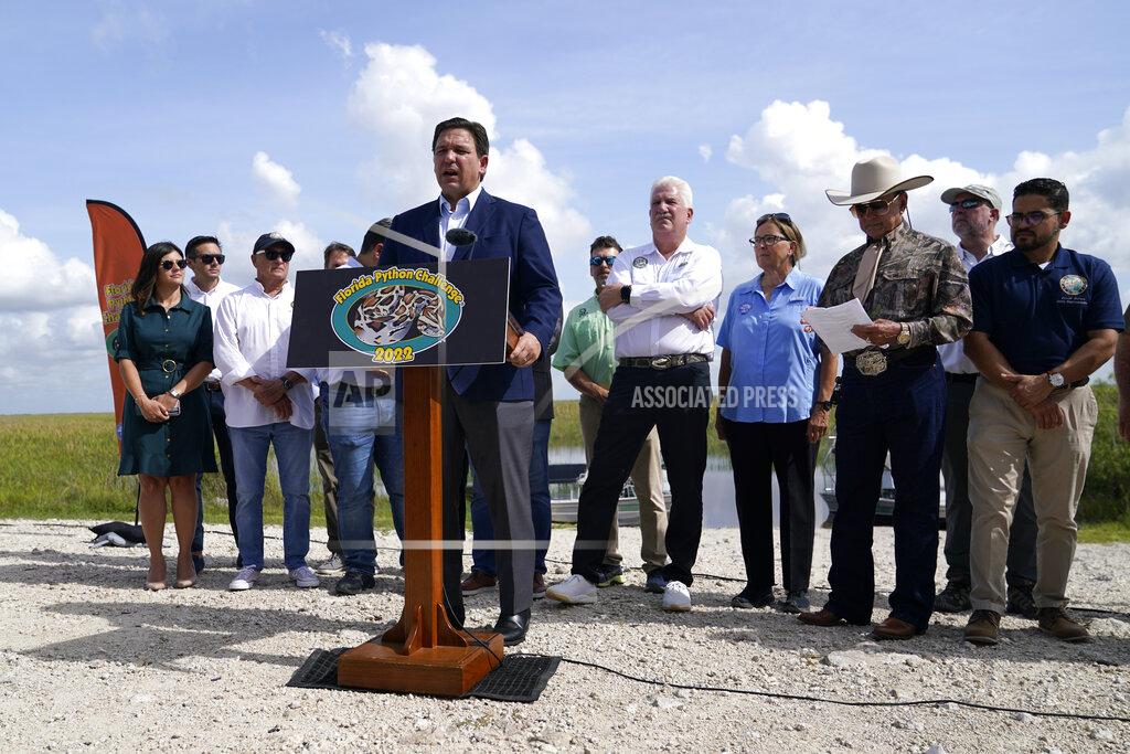 Lynne Sladky Florida Gov. Ron DeSantis speaks at a media event, Thursday, June 16, 2022, where he announced that registration for the 2022 Florida Python Challenge has opened for the annual 10-day event to be held Aug 5-14, in Miami. The Python Challenge is intended to engage the public in participating in Everglades conservation through invasive species removal of the Burmese python. (AP Photo/Lynne Sladky)