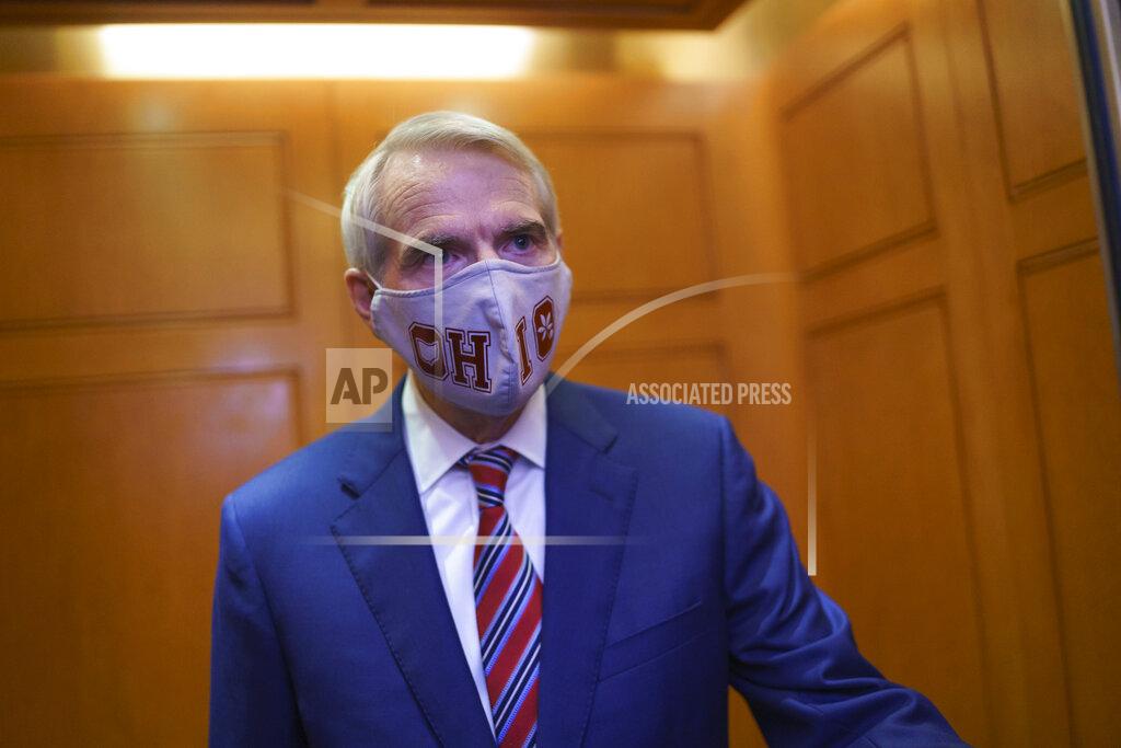 J. Scott Applewhite Sen. Rob Portman, R-Ohio, departs the Senate as lawmakers work to advance the $1 trillion bipartisan infrastructure bill, at the Capitol in Washington, Monday, Aug. 2, 2021. The 2,700-page bill includes new expenditures on roads, bridges, water pipes broadband and other projects, plus cyber security. (AP Photo/J. Scott Applewhite)