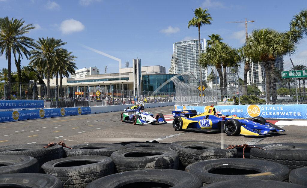 Jason Behnken FILE - In this March 11, 2018, file photo, Alexander Rossi (27) and Marco Andretti (98) race through Turn 10 during the IndyCar Firestone Grand Prix of St. Petersburg, in St. Petersburg, Fla. NASCAR and IndyCar have each called off their races this weekend. NASCAR was scheduled to run Sunday at Atlanta Motor Speedway without spectators but said Friday it is calling off this weekend and next week’s race at Homestead-Miami Speedway. IndyCar was scheduled to open its season Sunday on the streets of St. Petersburg, Florida, but suspended it’s season through the end of April. (AP Photo/Jason Behnken, File)