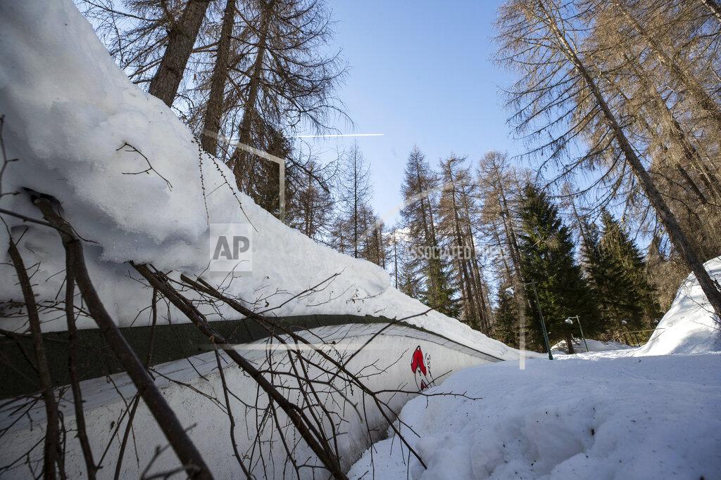 Gabriele Facciotti A view of the bobsled track in Cortina d'Ampezzo, Italy, Wednesday, Feb. 17, 2021. Bobsledding tradition in Cortina goes back nearly a century and locals are hoping that the Eugenio Monti track can be reopened for the 2026 Olympics in the Italian resort. (AP Photo/Gabriele Facciotti)