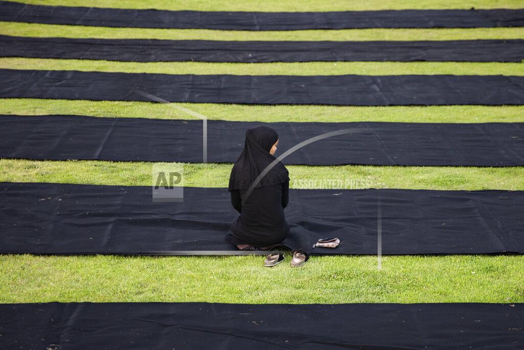 Oded Balilty A Muslim worshipper offers Eid al-Adha prayer in the mixed Arab Jewish city of Jaffa, near Tel Aviv, Israel, Tuesday, July 20, 2021. The major Muslim holiday, at the end of the hajj pilgrimage to Mecca, is observed around the world by believers and commemorates prophet Abraham's pledge to sacrifice his son as an act of obedience to God. (AP Photo/Oded Balilty)