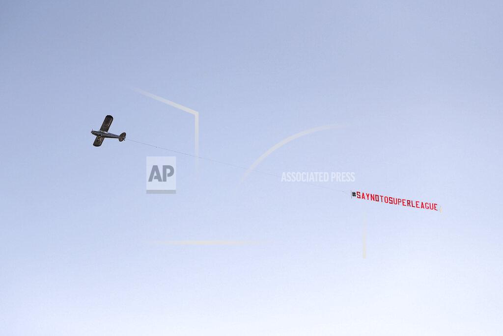 Zac Goodwin A plane with a 'Say No To Super League' banner flies over Elland Road, as a protest against Liverpool's decision to be included amongst the clubs attempting to form a new European Super League, in Leeds, England, Monday, April 19, 2021. Reaction to the proposals from 12 clubs to rip up European soccer by forming a breakaway Super League has ranged from anger and condemnation to humor and sarcasm. (Zac Goodwin/PA via AP)