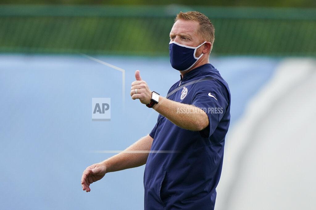 FILE - Tennessee Titans tight ends coach Todd Downing watches a drill during NFL football training camp in Nashville, Tenn., in this Friday, Aug. 28, 2020, file photo. Tennessee Titans coach Mike Vrabel announced promoting from within, Friday, Jan. 29, 2021. Todd Downing to offensive coordinator and Shane Bowen to defensive coordinator. (AP Photo/Mark Humphrey, Pool, File)