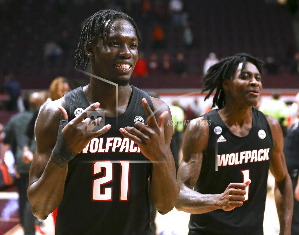 Matt Gentry North Carolina State's Ebenezer Dowuona (21) and Dereon Seabron (1) celebrate the team's win over Virginia Tech in an NCAA college basketball game Tuesday, Jan. 4, 2022, in Blacksburg, Va. (Matt Gentry/The Roanoke Times via AP)