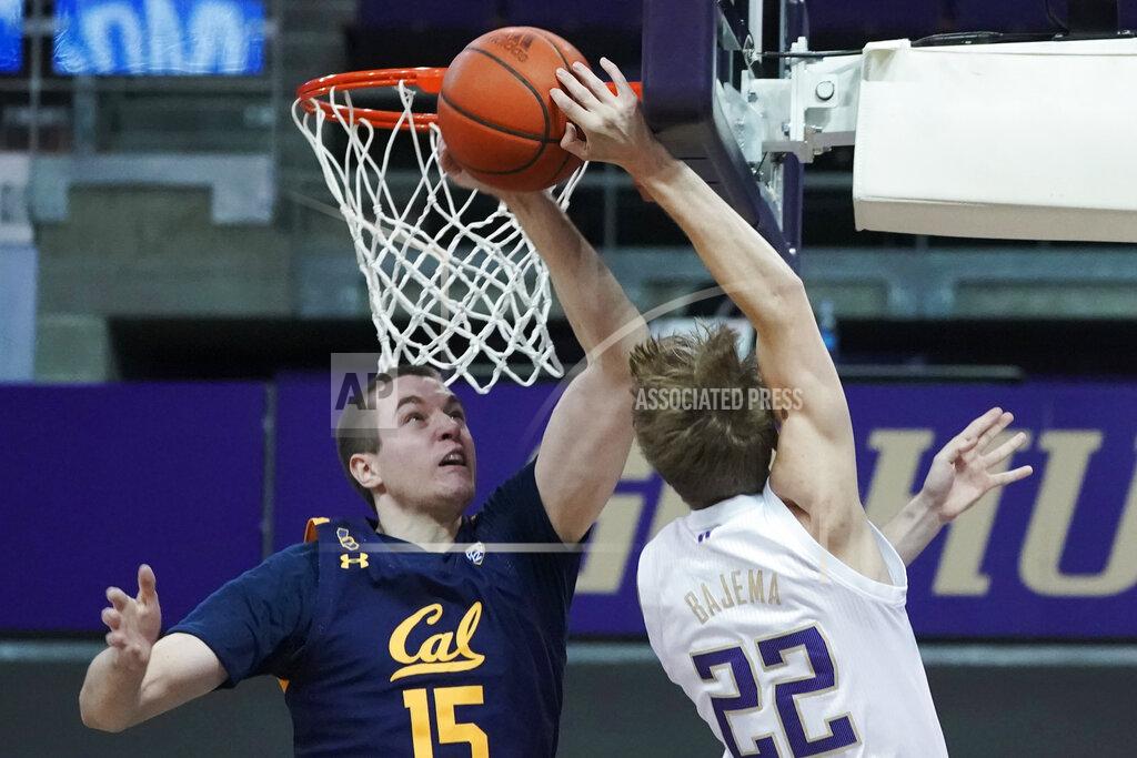 Ted S. Warren California forward Grant Anticevich (15) blocks a shot by Washington guard Cole Bajema (22) during the first half of an NCAA college basketball game Saturday, Feb. 20, 2021, in Seattle. (AP Photo/Ted S. Warren)