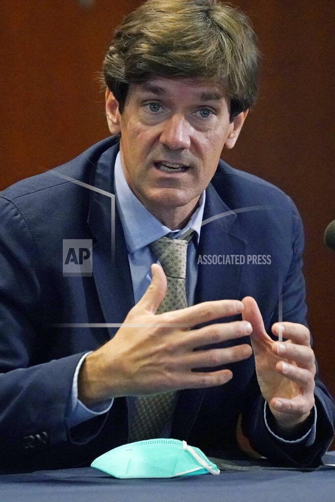 State health officer Dr. Thomas Dobbs explains how a person might react to a COVID-19 vaccination, during Gov. Tate Reeves' covid news briefing, Wednesday, Dec. 9, 2020 in Jackson, Miss. (AP Photo/Rogelio V. Solis)