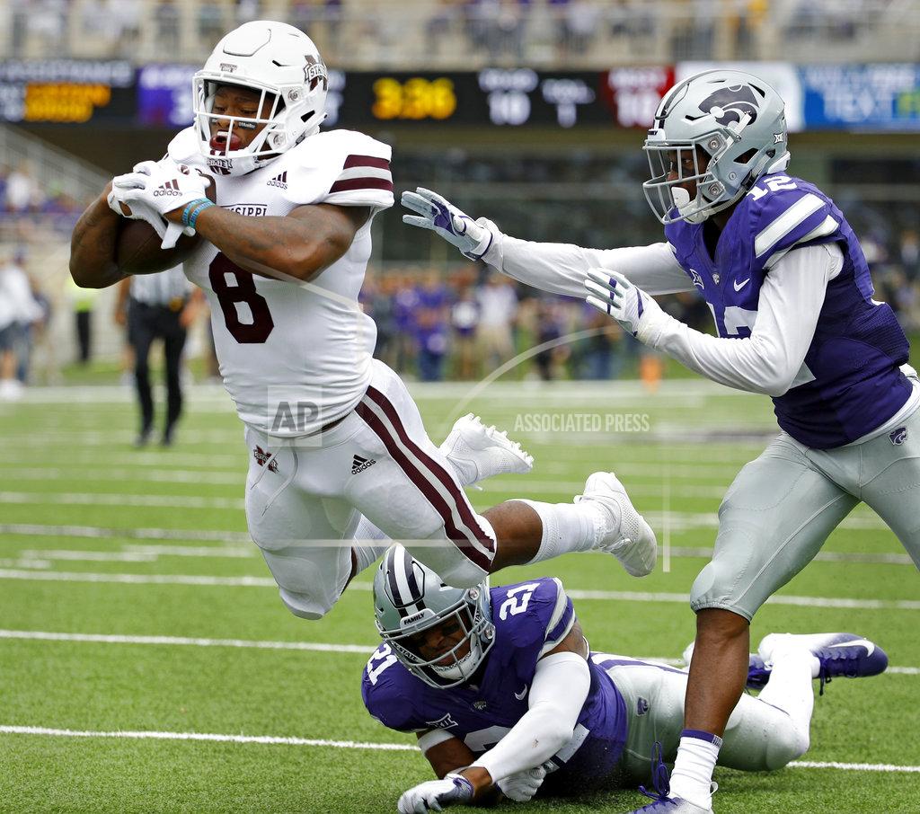 Charlie Riedel Mississippi State running back Kylin Hill (8) gets past Kansas State defensive backs AJ Parker (12) and Kendall Adams (21) to score a touchdown on a 16-yard run during the first half of an NCAA college football game Saturday, Sept. 8, 2018, in Manhattan, Kan. (AP Photo/Charlie Riedel)