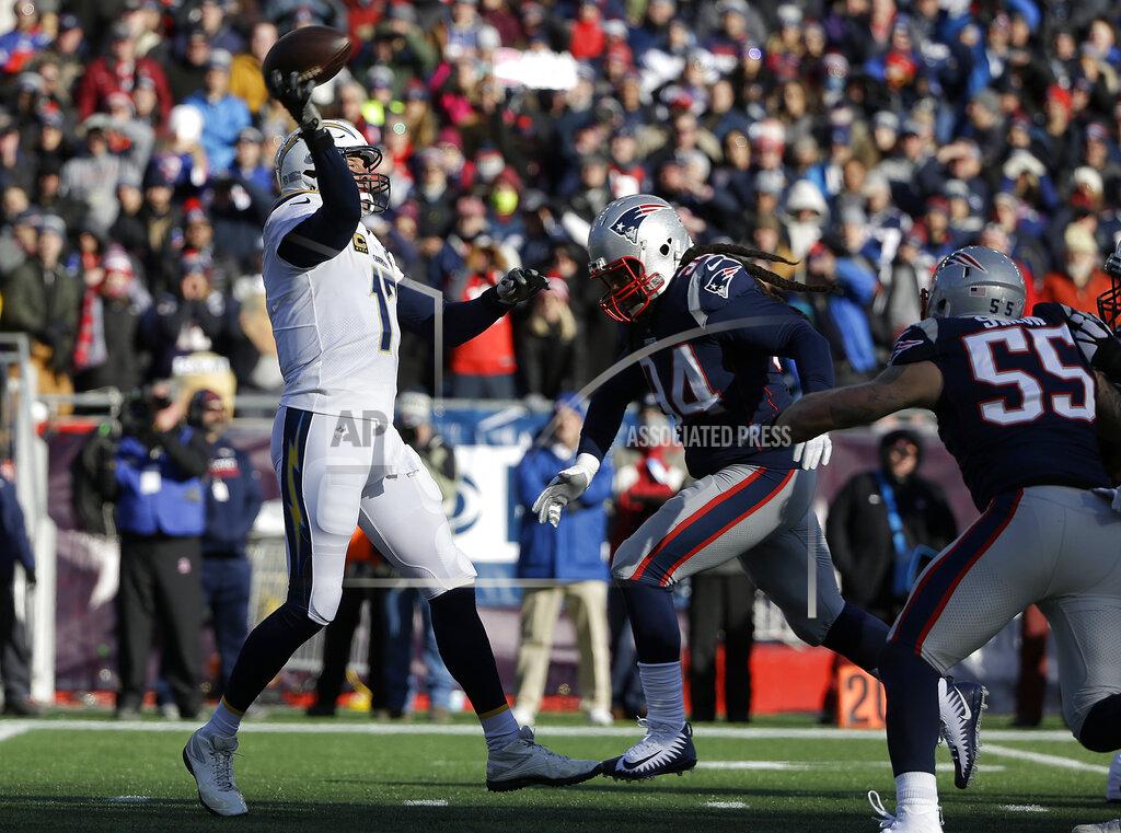 Steven Senne Los Angeles Chargers quarterback Philip Rivers, left, passes under pressure from New England Patriots linebacker Dont'a Hightower (54) during the first half of an NFL divisional playoff football game, Sunday, Jan. 13, 2019, in Foxborough, Mass. (AP Photo/Steven Senne)