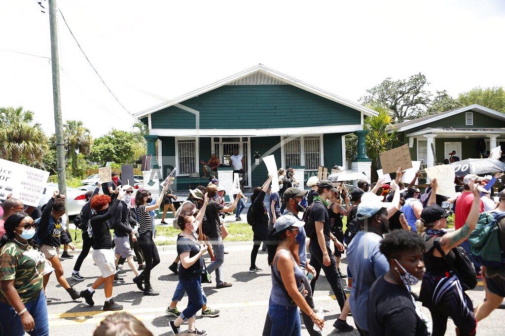 Octavio Jones Protesters march in Tampa, Fla., Sunday, May 31, 2020, in response to death of George Floyd, who died May 25 after he was pinned at the neck by a Minneapolis police officer. (Octavio Jones/Tampa Bay Times via AP)