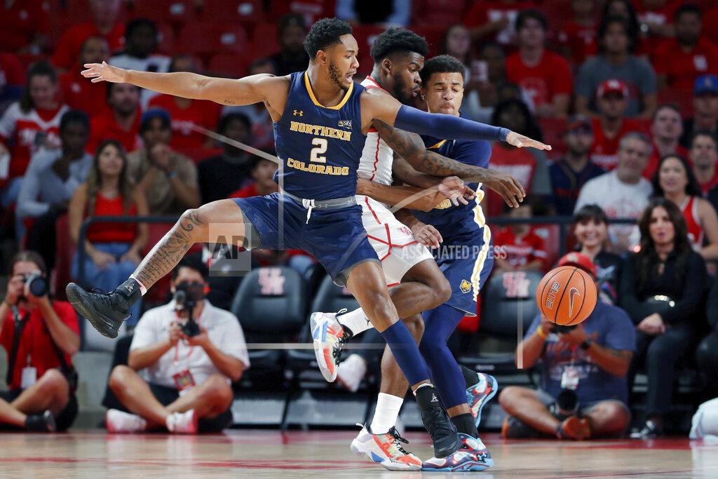 Michael Wyke Northern Colorado guard Matt Johnson II (2), Houston guard Jamal Shead, center, and Northern Colorado guard Daylen Kountz, right, become entangled as they chase the ball during the first half of an NCAA college basketball game Monday, Nov. 7, 2022, in Houston. (AP Photo/Michael Wyke)