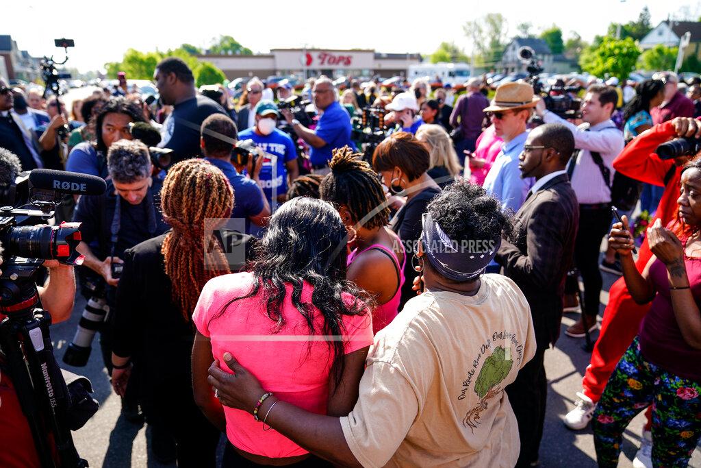 Matt Rourke FILE - People gather outside the scene of a shooting at a supermarket, in Buffalo, N.Y., on May 15, 2022. The NAACP, the nation's oldest civil rights organization said it will propose a sweeping plan meant to protect Black Americans from white supremacist violence, in response to a hate-fueled massacre that killed 10 Black people in Buffalo, New York last weekend. (AP Photo/Matt Rourke, File)