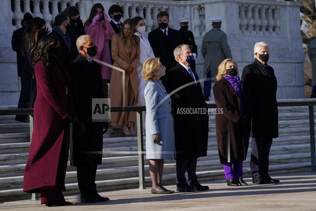 Evan Vucci FILE - In this Jan. 20, 2021, file photo former President Barack Obama and his wife Michelle, former President George W. Bush and his wife Laura and former President Bill Clinton and his wife former Secretary of State Hillary Clinton stand at the Tomb of the Unknown Soldier at Arlington National Cemetery during Inauguration Day ceremonies in Arlington, Va. (AP Photo/Evan Vucci, File)