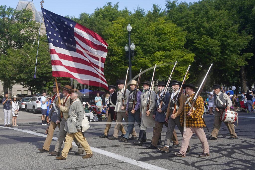 Rick Bowmer Members of the Mormon Battalion march during the Pioneer Day Parade Friday, July 23, 2021, in Salt Lake City. People in Utah are gathering to celebrate the state's history and recognize early Mormon pioneers who trekked West in search of religious freedom. Pioneer Day is a beloved only-in-Utah holiday every July 24 that features parades, rodeos, fireworks and more. The festivities were canceled last year because of the pandemic.(AP Photo/Rick Bowmer)