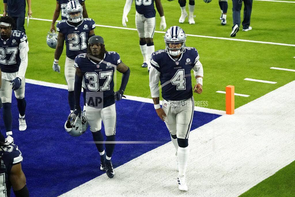 Ashley Landis The Dallas Cowboys including Dak Prescott (4) and Donovan Wilson (37) walk off the field after a loss to the Los Angeles Rams during an NFL football game Sunday, Sept. 13, 2020, in Inglewood, Calif. (AP Photo/Ashley Landis )