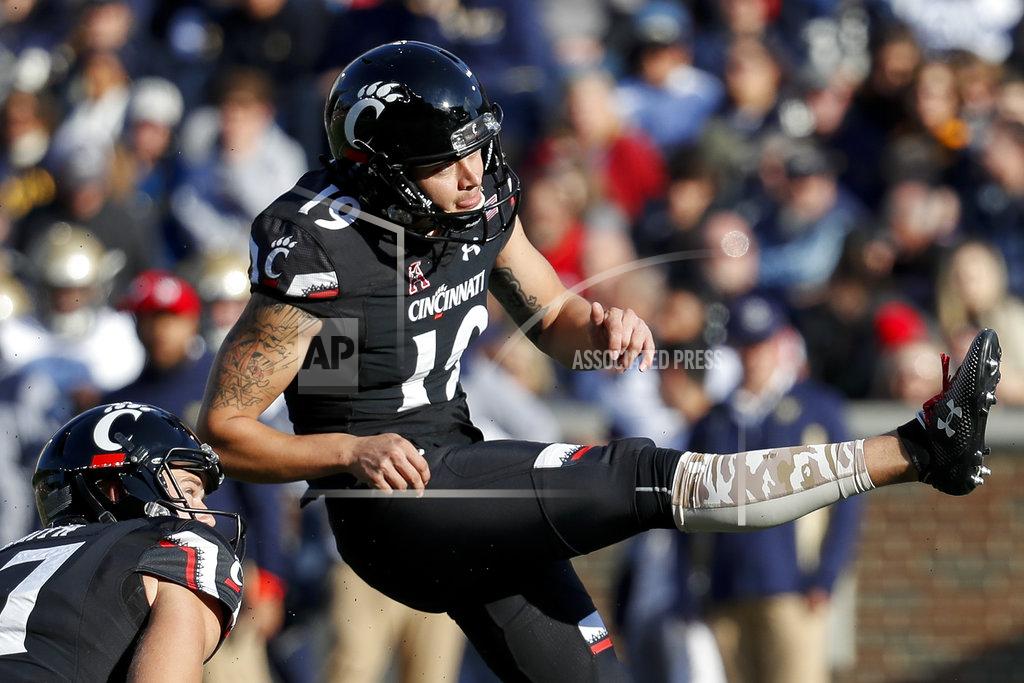 John Minchillo Cincinnati kicker Cole Smith (19) watches his extra point in the first half of an NCAA college football game against Navy, Saturday, Nov. 3, 2018, in Cincinnati. (AP Photo/John Minchillo)