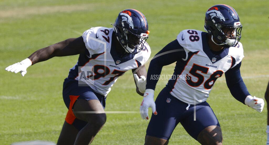 David Zalubowski Denver Broncos linebackers Von Miller, right, and Jeremiah Attaochu take part in drills during an NFL football practice Monday, Aug. 31, 2020, in Englewood, Colo. (AP Photo/David Zalubowski)