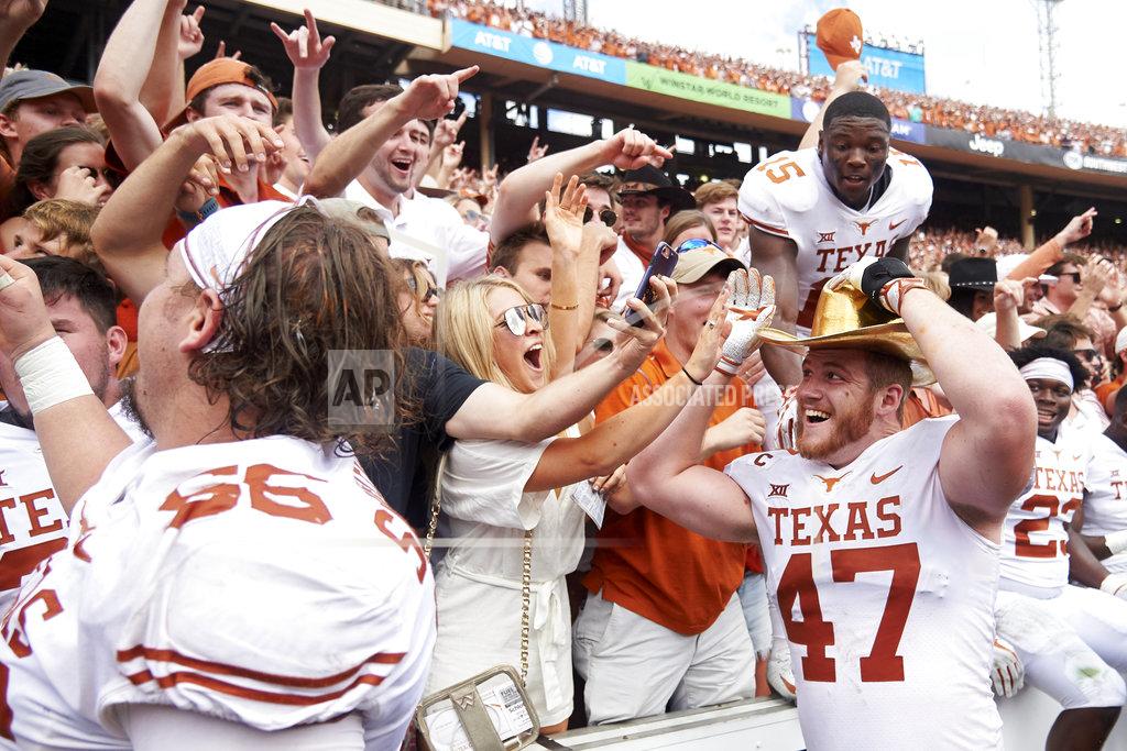 Cooper Neill Texas Longhorns tight end Andrew Beck (47) wears the Golden Hat and celebrates with fans after defeating Oklahoma 48-45 in an NCAA college football game at the Cotton Bowl, Saturday, Oct. 6, 2018, in Dallas. (AP Photo/Cooper Neill)