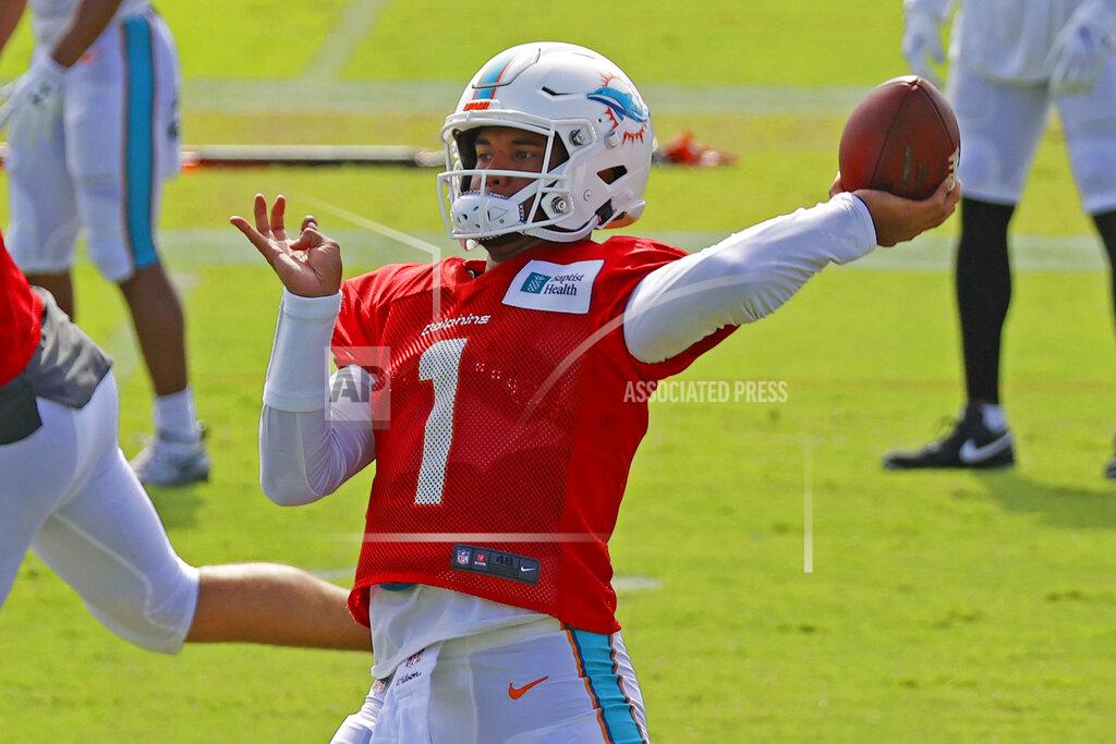 Miami Dolphins quarterback Tua Tagovailoa (1) throws the ball during an NFL football training camp practice in Davie, Fla., Monday, Aug. 17, 2020. (AP Photo/Joel Auerbach)