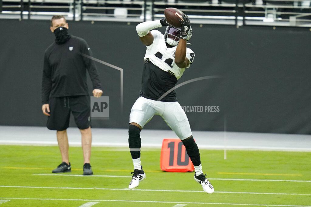 John Locher Las Vegas Raiders cornerback Amik Robertson (41) catches the ball during an NFL football training camp practice Friday, Aug. 21, 2020, in Las Vegas. (AP Photo/John Locher)