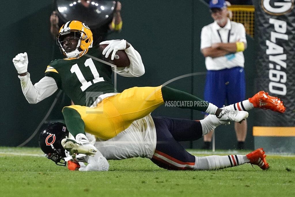 Morry Gash Green Bay Packers wide receiver Sammy Watkins (11) is tackled after catching a pass during the first half of an NFL football game against the Chicago Bears Sunday, Sept. 18, 2022, in Green Bay, Wis. (AP Photo/Morry Gash)