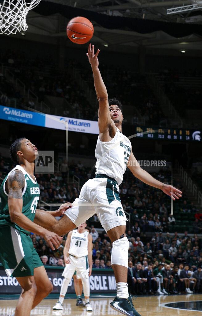 Al Goldis Michigan State's Malik Hall, right, shoots against Eastern Michigan's Jalen King during the second half of an NCAA college basketball game, Saturday, Dec. 21, 2019, in East Lansing, Mich. (AP Photo/Al Goldis)