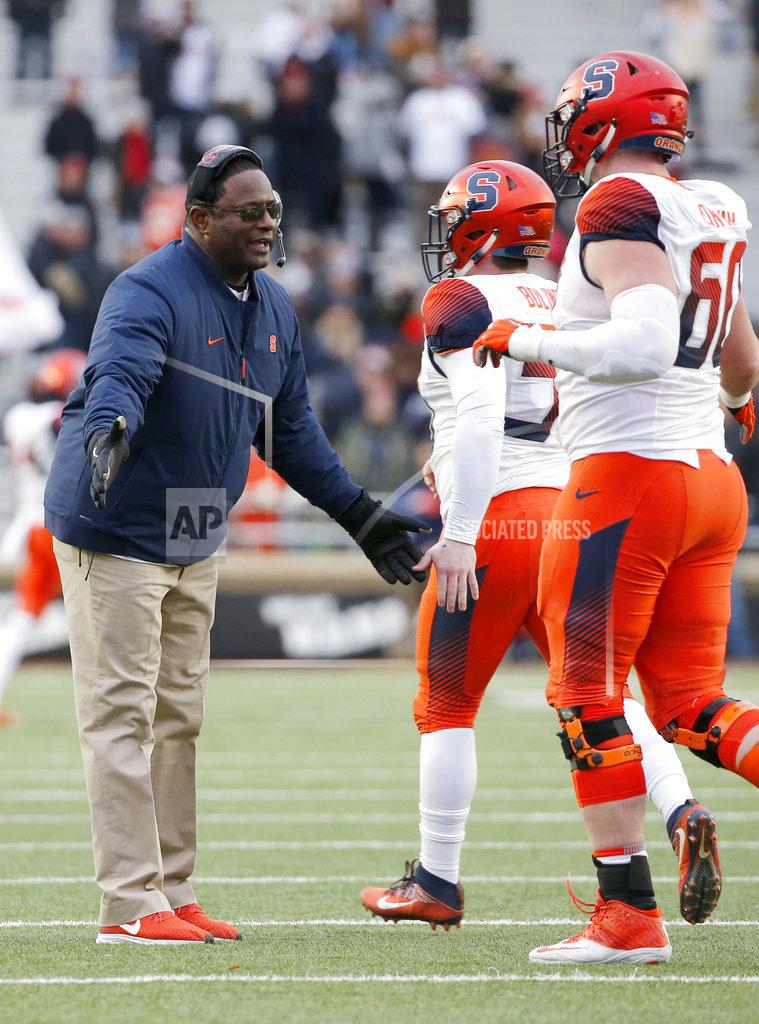 Mary Schwalm Syracuse head coach Dino Babers congratulates his team after an extra point conversion during the second half of an NCAA college football game against Boston College, Saturday, Nov. 24, 2018, in Boston. (AP Photo/Mary Schwalm)