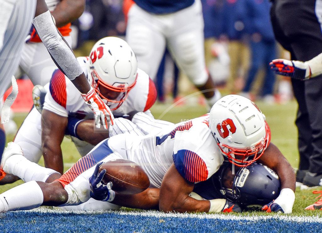 Howard Simmons Notre Dame running back Dexter Williams, bottom, crosses the goal line to score the first half of an NCAA college football game against Syracuse, Saturday, Nov. 17, 2018, at Yankee Stadium in New York. (AP Photo/Howard Simmons)