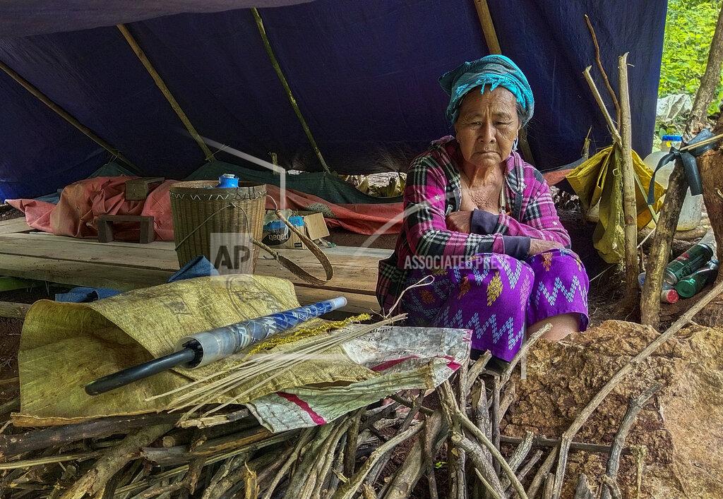 Uncredited An internally displaced woman sits inside her makeshift tent at Pu Phar Village, Demawso Township, Kayah State on Thursday June 17, 2021. A report on the situation in conflict-affected areas of Myanmar issued this week by the U.N.'s Office for the Coordination of Humanitarian Affairs says around 108,800 people from Kayah State were internally displaced following an escalation of hostilities between the government military and the local Karenni People's Defense Force militia since the coup Feb. 1, 2021. (AP Photo)