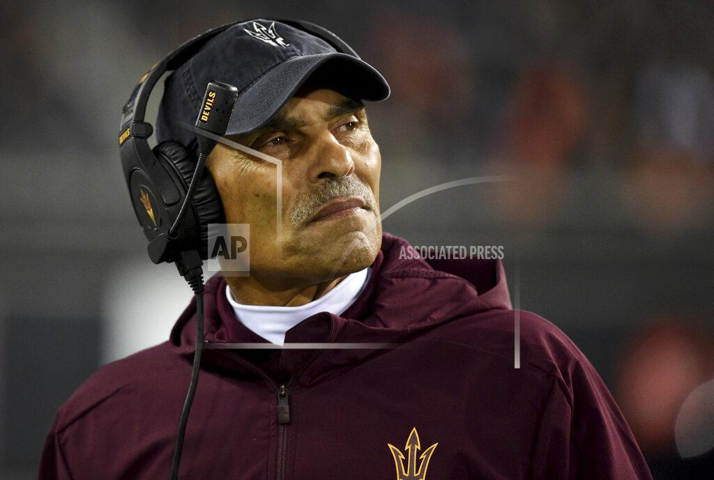 Steve Dykes File-This Nov. 16, 2019, file photo shows Arizona State coach Herm Edwards watching from the sideline during the second half of the team's NCAA college football game against Oregon State in Corvallis, Ore. In 2003, the NFL had three minority head coaches: future Pro Football Hall of Famer Tony Dungy, Edwards and Marvin Lewis. In the 12 previous seasons, there had been six. Total. Considering that the majority of the players in the league 16 years ago were minorities, that imbalance was enormous. And disturbing. And, frankly, it was unfair. Paul Tagliabue, then the NFL commissioner, put together a committee that established the "Rooney Rule," which requires all teams with coaching and front office vacancies to interview minority candidates. The rule, long overdue, was named for Dan Rooney, then president of the Pittsburgh Steelers and the overseer of that committee. (AP Photo/Steve Dykes, File)