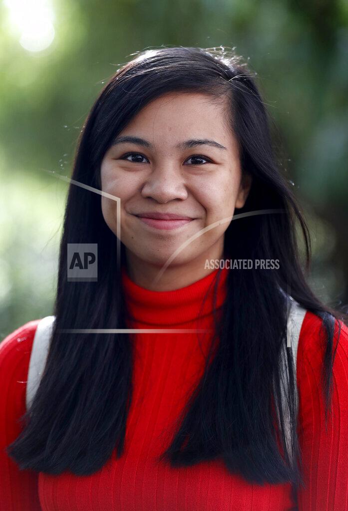 Frank Augstein Danica Marcos, in a park in London, Friday, Oct. 16, 202. Danica Marcos a volunteer as U.K. researchers are preparing to begin a controversial experiment that will infect healthy volunteers with the new coronavirus to study the disease in hopes of speeding up development of a vaccine. (AP Photo/Frank Augstein)